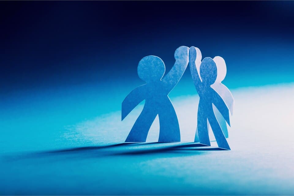Partnership concept with blue paper figures